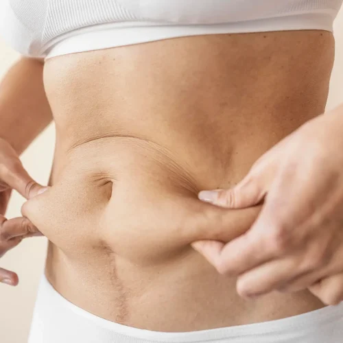close-up-hands-holding-belly